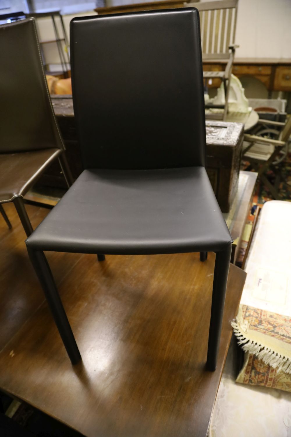 A military style mahogany and brass bound twin pillar dining table, width 182cm extended (one spare leaf) and six brown leather chairs